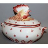AN OVAL COCKEREL TUREEN AND COVER. 12ins long.