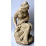 A RECONSTITUTED STONE FIGURE OF A SEATED FEMALE NUDE. 2ft 0ins high.