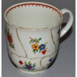 AN 18TH CENTURY WORCESTER POLYCHROME QUEENS FLORAL COFFEE CUP painted with flowers in panels.