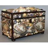 A 19TH CENTURY SHELL MOUNTED TWO DIVISION TEA CADDY, 8.5ins wide, smothered in shells.