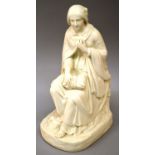 A 19TH CENTURY ENGLISH PARIAN FIGURE of a young girl seated on a rocky mound.