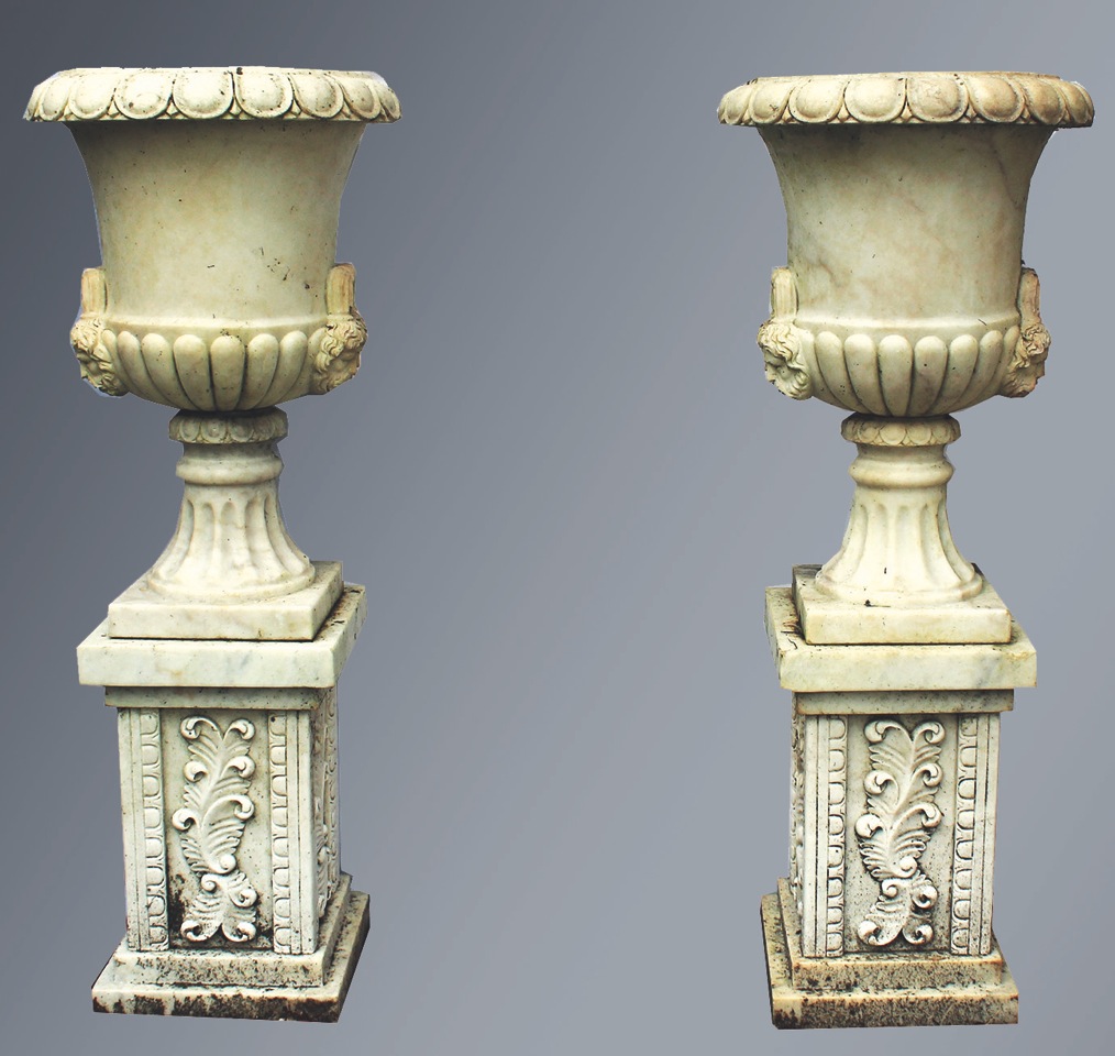 A GOOD PAIR OF CARVED WHITE MARBLE TWO HANDLED CAMPAGNA URN SHAPED VASES ON STANDS, with egg and