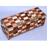 AN INLAID RECTANGULAR AGATE BOX AND COVER “KARLSBAND” on four bun feet 7.5ins wide.