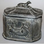AN OCTAGONAL BOX AND COVER, the pagoda shaped lid with a reclining dog handle, the sides with two