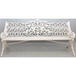 A VERY GOOD WHITE PAINTED CAST IRON FOUR SEATER GARDEN BENCH, the back and arms with fruiting