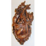 A GOOD BLACK FOREST CARVED WALL POCKET, 16ins long, formed as a basket with rabbits, pheasants and
