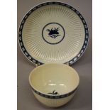 AN 18TH CENTURY WORCESTER FINELY RIBBED TEA BOWL AND SAUCER, painted with a central flower and a