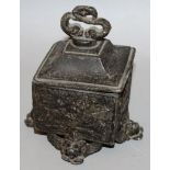 A VERY GOOD SQUARE BOX AND COVER, the lid with an entwined dolphin handle, the sides with fox