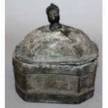 AN OCTAGONAL CIRCULAR BOX AND COVER, the lid with a head handle with plain sides. 5ins wide, 5.