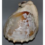 A GOOD ENGRAVED NAUTILUS SHELL, classical scene with angels and cupids 6ins long.