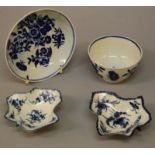 A PAIR OF 18TH CENTURY WORCESTER LEAF SHAPE DISHES, painted with scattered flowers in blue and a