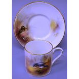 A 19TH CENTURY ROYAL WORCESTER COFFEE CAN AND SAUCER painted with a Snipe and a Wood Pigeon by James