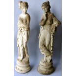 A RECONSTITUTED PAIR OF GARDEN ORNAMENTS modelled on standing female nudes. 2ft 2ins high.