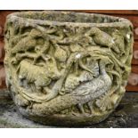 A RECONSTITUTED STONE WEATHERED CIRCULAR GARDEN URN with moulded decoration depicting birds and