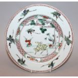 A GOOD CHINESE KANGXI PERIOD FAMILLE VERTE PORCELAIN PLATE, circa 1700, painted to its centre with a