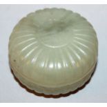 A SMALL CHINESE JADE BOX & COVER, carved in the form of a lobed flowerhead, 2.1in diameter.