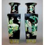 A LARGE PAIR OF CHINESE BLACK-GROUND FAMILLE VERTE PORCELAIN VASES, each flaring square-section body