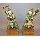 A GOOD LARGE PAIR OF EARLY/MID 20TH CENTURY CHINESE FAMILLE VERTE BISCUIT GLAZED FIGURES OF TEMPLE