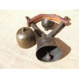 TWO FINE CUP SHEEP BELLS AND A WIDE MOUTH BELL. The cup bells, 18th century. The larger marked ‘