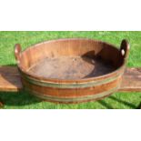 A FINE WOODEN DAIRY PAN (QUERN) Cooper-made, 68cm wide at handles. Mid-19th century. Scarce. To