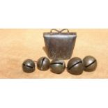 FIVE FINE RUMBLER BELLS AND A CLUCKET BELL. All late 18th century. The large rumblers are decorated.