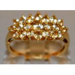 A GOOD CLUSTER DRESS RING set in 9ct gold.