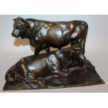 ROSA BONHEUR (1822-1899) FRENCH A GOOD BRONZE GROUP OF A STANDING BULL, COW LAYING DOWN. Signed 10.