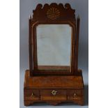AN 18TH CENTURY WALNUT TOILET MIRROR with fretwork top and shelf, the base with three drawers and