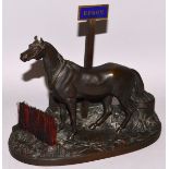 X. MAISON ALPHONSE GIROUX PARIS A GOOD BRONZE OF A HORSE STANDING BY A HURDLE with enamel sign