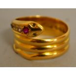 A GOOD 18CT YELLOW GOLD DIAMOND AND RUBY SNAKE RING.