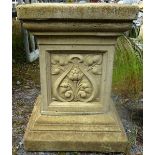 A SQUARE SHAPED GARDEN PLINTH with Art Nouveau designed panels 1ft 7ins high.