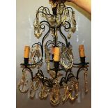 A 19TH CENTURY FRENCH GILT METAL AND GLASS CHANDELIER with cut glass drops and four candle