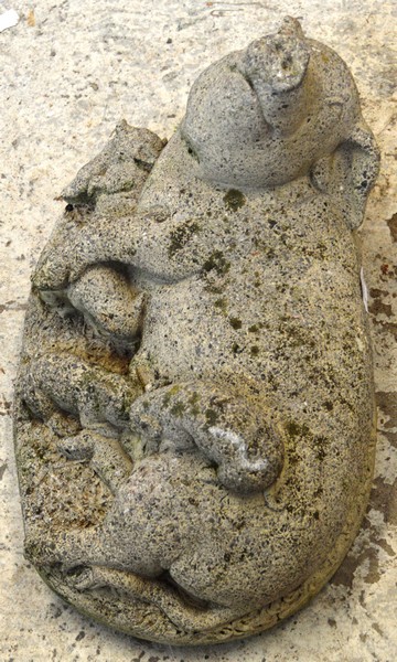 A RECONSTITUTED STONE GARDEN ORNAMENT modelled as a sow and  piglets 1ft 6ins long.