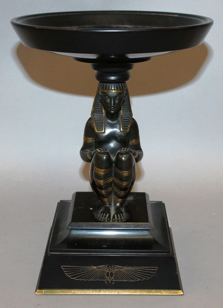 A GOOD REGENCY BRONZE “EGYPTIAN” TAZZA, a gilt decorated sphinx holding aloft a circular dish,