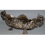 A GOOD OVAL TWO HANDLED FRUIT BOWL stamped PRADA with scroll and shell mounts, on four pad feet