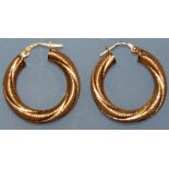 A PAIR OF GOLD AND DIAMOND HOOP EARRINGS.