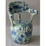 AN UNUSUAL CHINESE BLUE AND WHITE PORCELAIN SEAT painted with fish and other emblems.