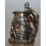 AN ETIENNE GARANT PLATED MUG with repousse decoration, female nude and cherub 5ins high.