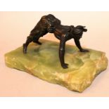 AN UNUSUAL 1920’S BRONZE OF A CLOWN ON ALL FOURS on a green onyx base. 6ins wide overall.