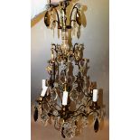 A 19TH CENTURY FRENCH GILT METAL AND GLASS CHANDELIER with cut glass, plain and coloured prism
