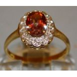 A GOOD AMBER OVAL DRESS RING set in 9ct gold.