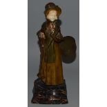 A GOOD AUSTRIAN GILT BRONZE AND IVORY FIGURE OF A YOUNG GIRL carrying an umbrella and basket with