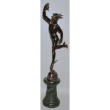 A GOOD 19TH CENTURY BRONZE, ATER THE ANTIQUE, OF MERCURY standing on a grey marble column. 34ins