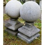 A PAIR OF RECONSTITUTED STONE BALL GATEPOST FINIALS 1ft 9ins high.