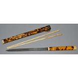 A PAIR OF IVORY CHOPSTICKS in a tortoiseshell case.