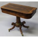 A GOOD REGENCY ROSEWOOD CARD TABLE with superb quality banding and inlay, fold over swivel top
