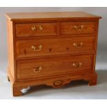 A PINE STRAIGHT FRONT CHEST OF TWO SHORT AND THREE LONG GRADUATED DRAWERS with brass handles on