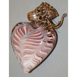 A GLASS HEART SHAPED PENDANT.