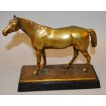 A BRONZE STANDING HORSE on a rectangular base. 9ins long.