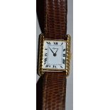 A VERY GOOD LADIES 18CT YELLOW GOLD WRISTWATCH with leather strap.